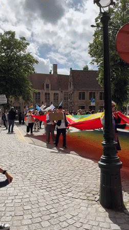 Pride celebration through historic Bruges streets and squares