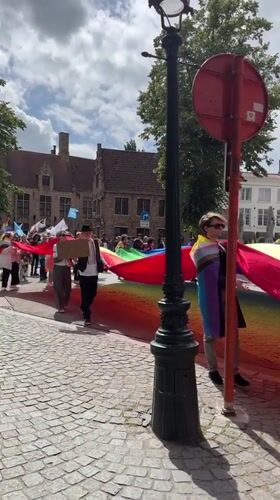 Pride celebration through historic Bruges streets and squares