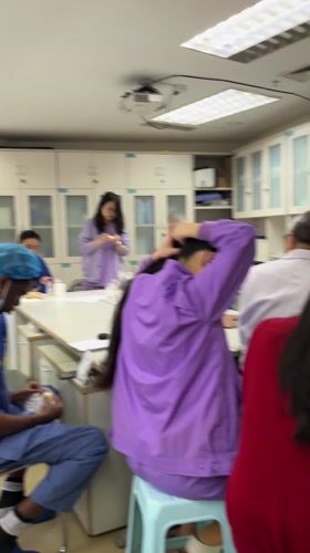 Medical staff gather around table in Yuzhong District