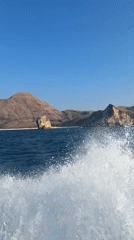 Boat ride through choppy Indonesian coastal waters