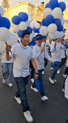 Community parade with bands, families proceeds through Arequipa streets