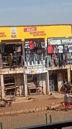 Street market in Bukuru selling clothes and personal care products