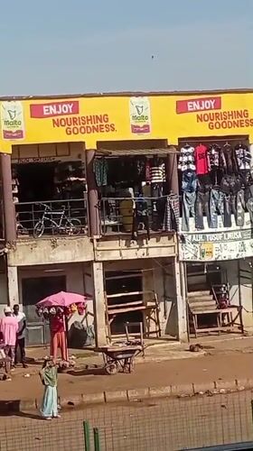 Street market in Bukuru selling clothes and personal care products