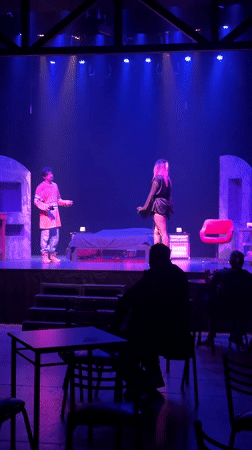 Late-night theatrical performance captured on stage in Buenos Aires