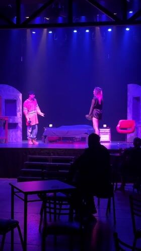 Late-night theatrical performance captured on stage in Buenos Aires