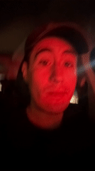 Man photographed in car listening to music in Puebla