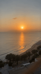 Golden sunset over calm waters in Castellammare del Golfo