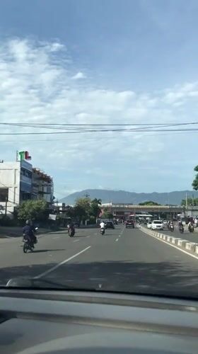 Early morning traffic captured on divided road in Banda Aceh