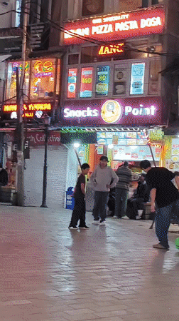 Manali's night market buzzing with food, people, and street life