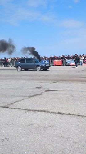 Two cars drag race on track in Ostrovo, Bulgaria