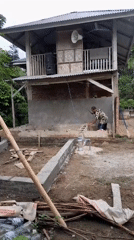Construction work underway at wooden building in Lhokjok, Indonesia