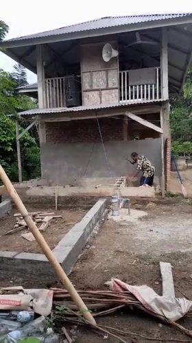 Construction work underway at wooden building in Lhokjok, Indonesia