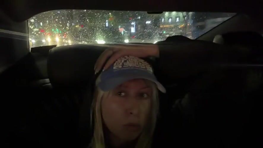 Blonde woman in baseball cap spotted in Seoul car