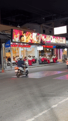 Night street scene with massage parlor signs in Pattaya