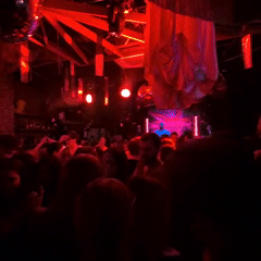 Nightclub scene captured in Perm with DJ and dancing crowd