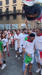 San Fermín festival crowds fill Pamplona's streets in red and white