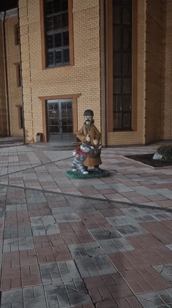 Nighttime scenes documented across Sergeevka, Russia showing statues and vehicles
