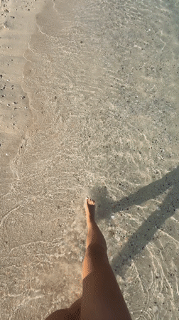Early morning shell collecting observed on Dubai beach