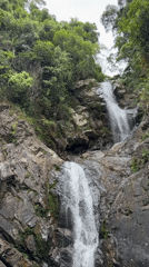 Waterfall and gardens at a named scenic spot near Huế