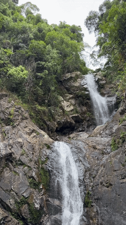 Waterfall and gardens at a named scenic spot near Huế