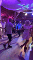 Circle dancing under colored lights in Montana, Bulgaria
