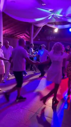 Circle dancing under colored lights in Montana, Bulgaria