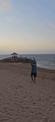 Evening beach scenes document mixed activities, cleanup in Denpasar