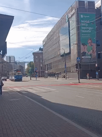 Tallinn streets: Corvette on display, murals, and midday city life