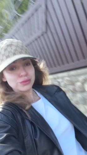 Woman in designer attire spotted in Mishutkino, Russia