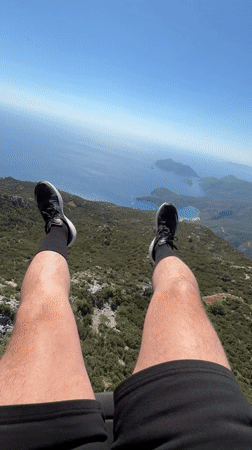 Paragliders launch and fly over Fethiye coastline