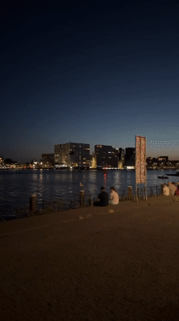 Twilight by the A'DAM Toren, Amsterdam waterfront at night