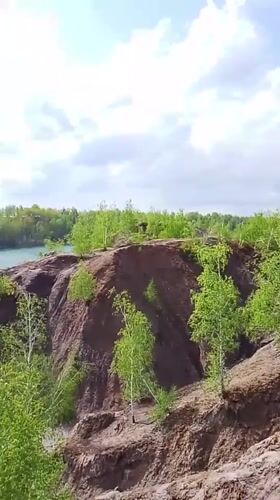 Witness films scenic turquoise lake near Pisarevo, Russia