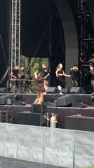 Live stage performance and a cat lounging nearby