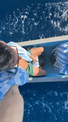 Two people spotted boating off Indonesian coast with striped towel