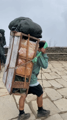 Dawn mountain activity captured in foggy Nepal hiking region