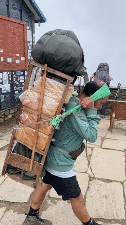 Dawn mountain activity captured in foggy Nepal hiking region