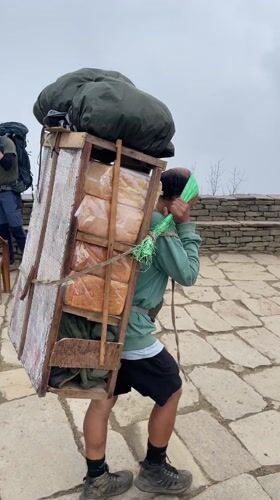 Dawn mountain activity captured in foggy Nepal hiking region