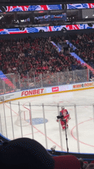 Packed arena, red-clad crowd at Dumino hockey game