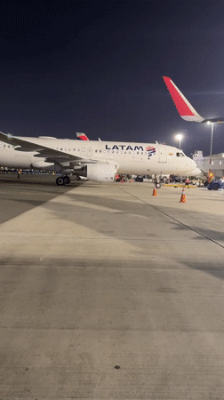 LATAM aircraft on night tarmac at Lima's international airport