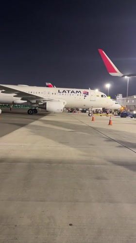 LATAM aircraft on night tarmac at Lima's international airport