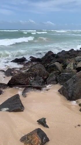 Tourist documents scenic Ahangama beach views in Sri Lanka