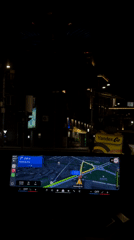 Woman drives through Yerevan at night with GPS navigation
