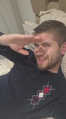 Man photographed in playful bedroom poses in Bulgarian village