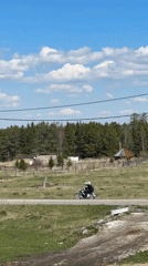 Rural moments captured in Tyulyuk: woman, bird, motorcyclist observed