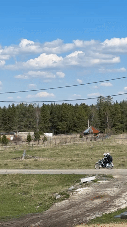 Rural moments captured in Tyulyuk: woman, bird, motorcyclist observed