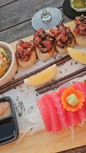 Sunset sashimi dinner documented on Ko Tao beach