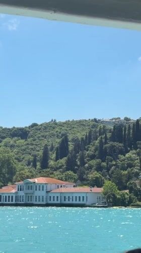 Boat passenger documents Bosphorus journey past Ottoman landmarks