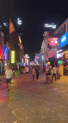 Typical evening crowds gather on Pattaya's neon-lit Walking Street