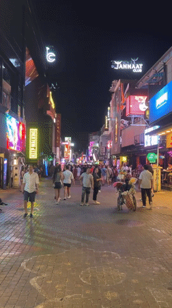 Typical evening crowds gather on Pattaya's neon-lit Walking Street
