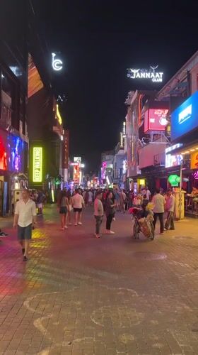 Typical evening crowds gather on Pattaya's neon-lit Walking Street